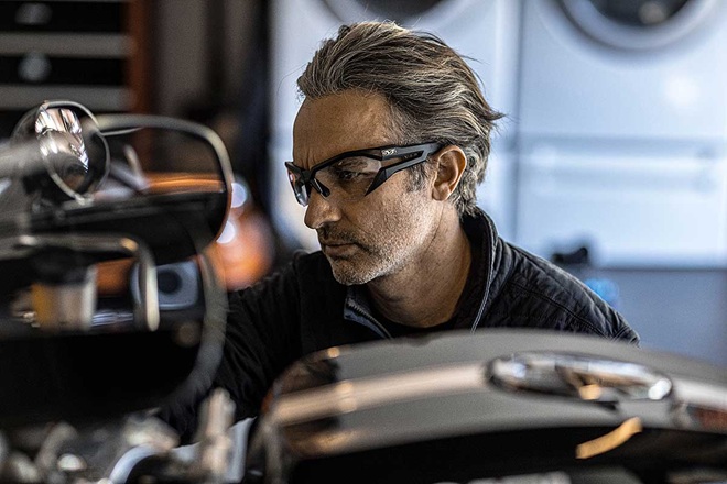 person wearing mechanix safety glasses